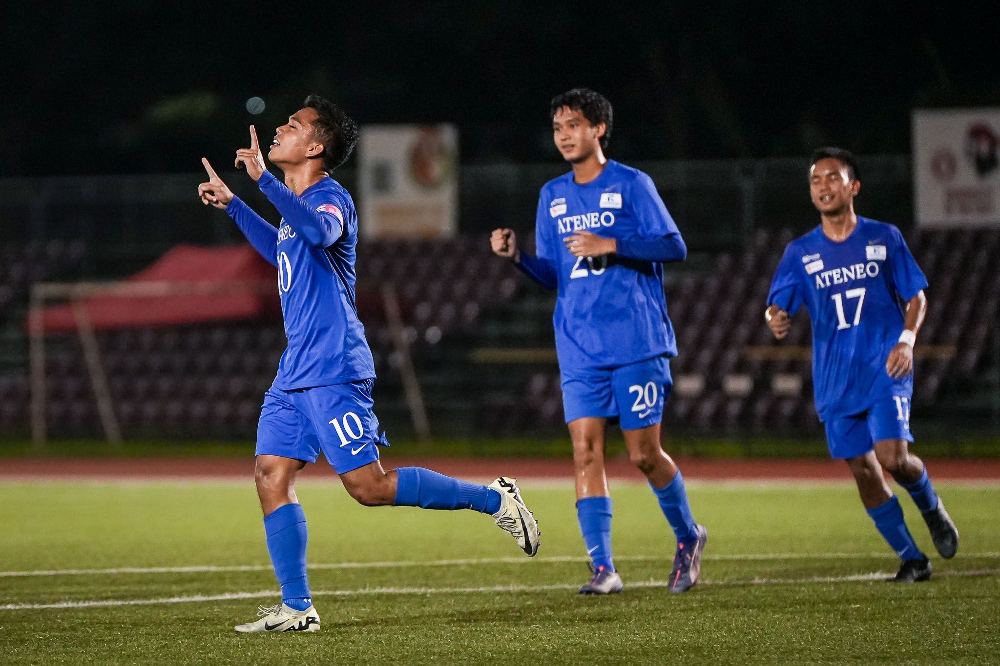 Ateneo's Leo Maquiling celebrates after converting a spot kick against UE in the UAAP Season 87 men's football tournament, Sunday at the UP Diliman Football Stadium. UAAP Media